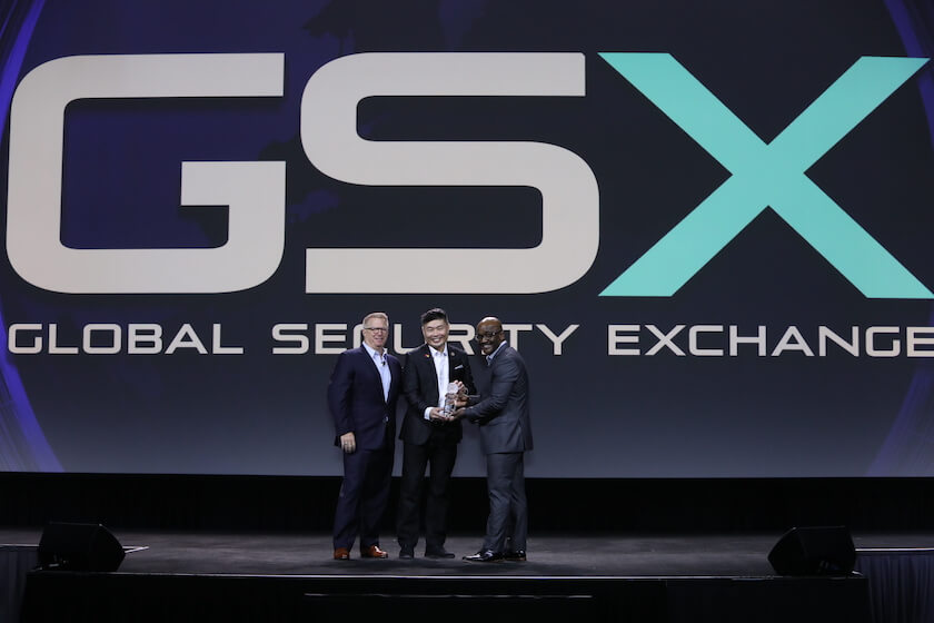 Three men on stage at Global Security Exchange (GSX) award ceremony